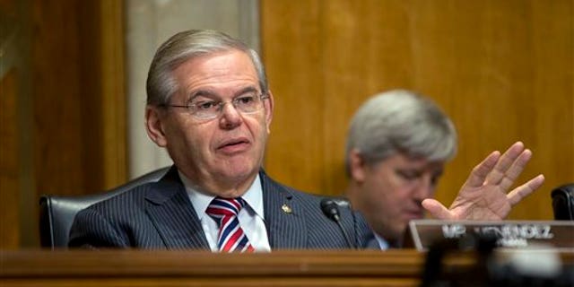 FILE - In this Jan. 9, 2014, file photo, Senate Foreign Relations Committee Chairman Sen. Robert Menendez, D-N.J., asks questions at a hearing on Capitol Hill in Washington, Thursday, Jan. 9, 2014. Menendez paid a law firm $250,000 in December 2013 for legal costs related to Justice Department and Senate Ethics Committee investigations into his ties with a major campaign donor. The Democrat also has set up a legal trust to raise money as the investigations continue. (AP Photo/Pablo Martinez Monsivais, File)