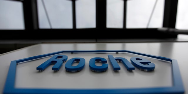 The logo of the Swiss drugmaker Roche is seen on a factory in Burgdorf near Bern, Switzerland.
