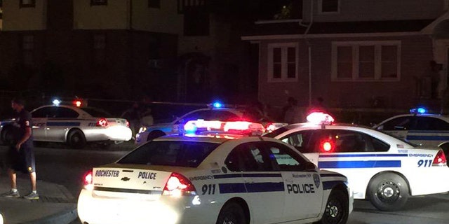 In this photo provided by WHEC-TV, police vehicles block off the street after official said a fatal shooting occurred in Rochester, N.Y., Wednesday, Aug. 19, 2015. Officials have not yet released the names of the victims or the conditions of the several injured. (Jennifer Mobilia/WHEC-TV via AP) MANDATORY CREDIT