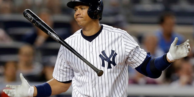 Alex Rodriguez reacts after striking out against the Los Angeles Angels, on Aug. 13, 2013.