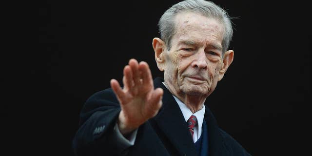 Romania's former King Michael I waves to supporters during an appearance at the Elisabeta Palace in Bucharest, Romania, Wednesday, Nov. 19, 2014. Former monarch King Michael, 93, the only surviving leader from World War II, invited President-elect Klaus Iohannis to lunch Wednesday at his Elizabeth Palace.(AP Photo/Octav Ganea, Mediafax) ROMANIA OUT