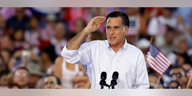 Republican Presidential candidate and former Massachusetts Gov. Mitt Romney salutes to the crowd during a campaign speech Friday, Oct. 5, 2012, in St. Petersburg, Fla. (AP Photo/Chris O'Meara)