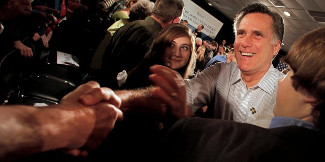 Republican presidential candidate, former Massachusetts Gov. Mitt Romney greets the crowd during a campaign stop Saturday, March 17, 2012, in Collinsville, Ill. (AP Photo/Charlie Riedel)