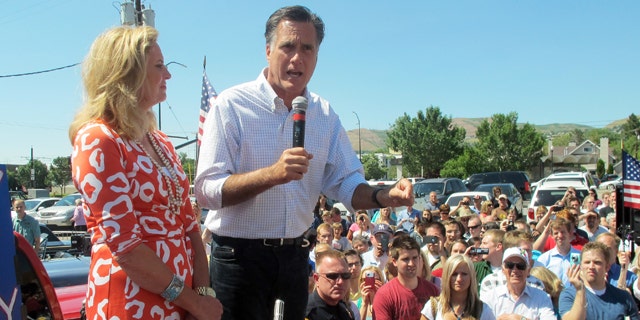June 24: Former Massachusetts Gov. Mitt Romney and his wife, Ann, greet supporters at a drive-in hamburger restaurant in Salt Lake City.