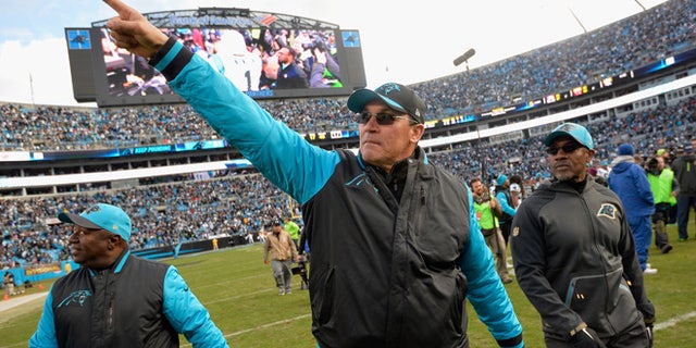 Head coach Ron Rivera of the Carolina Panthers salutes the crowd after defeating the Seattle Seahawks 31-24 at the NFC Divisional Playoff Game at Bank of America Stadium on January 17, 2016 in Charlotte, North Carolina. (Photo by Grant Halverson/Getty Images)