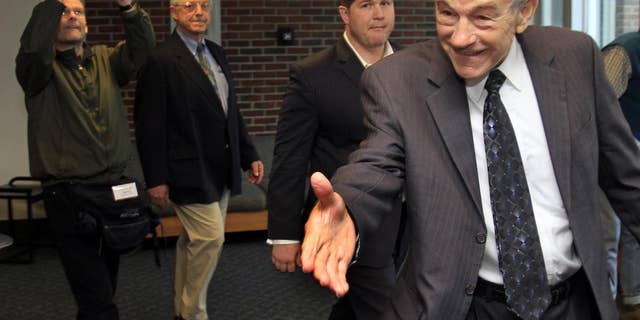 Possible 2012 presidential candidate, U.S. Rep. Ron Paul, R-Texas reaches out to greet students at the University of New Hampshire Thursday, March 24, 2011 in Durham, NH (AP Photo/Jim Cole)