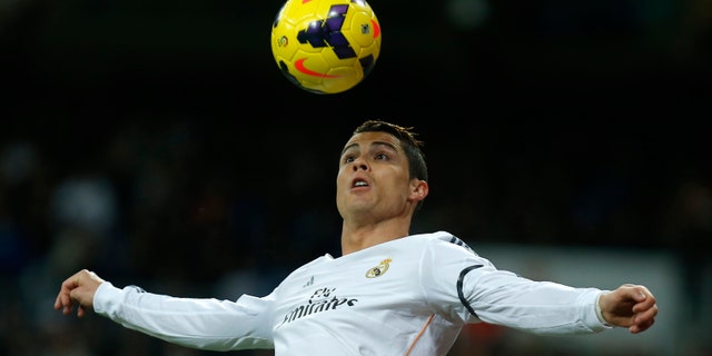 Ronaldo controls the ball during a soccer match between Real Madrid and Celta Vigo in Madrid, Spain, Jan. 6, 2014.