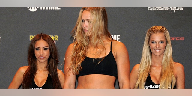 Ronda Rousey, shown here at a weigh-in at Palms Hotel and Casino in Las Vegas, is the sport's most recognizable female fight. (AP)
