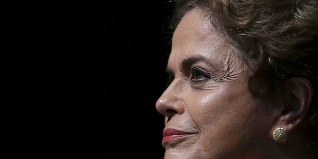 Brazil's President Dilma Rousseff attends the opening of the National Conference of Women, in Brasilia, Brazil, Tuesday, May 10, 2016. The impeachment proceedings against Rousseff took another hairpin turn Tuesday after the acting speaker of Congress' lower house Waldir Maranhao put the impeachment process back on track a day after he sparked chaos and sowed further discord among Brazil's fractious political class by annulling an April 17 vote by the Chamber of Deputies for impeachment. (AP Photo/Eraldo Peres)