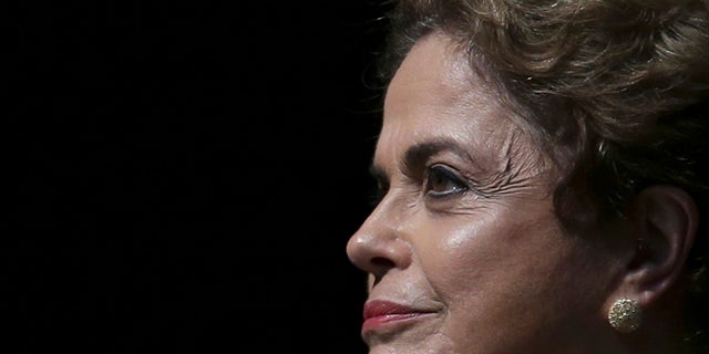 Brazil's President Dilma Rousseff attends the opening of the National Conference of Women, in Brasilia, Brazil, Tuesday, May 10, 2016. The impeachment proceedings against Rousseff took another hairpin turn Tuesday after the acting speaker of Congress' lower house Waldir Maranhao put the impeachment process back on track a day after he sparked chaos and sowed further discord among Brazil's fractious political class by annulling an April 17 vote by the Chamber of Deputies for impeachment. (AP Photo/Eraldo Peres)