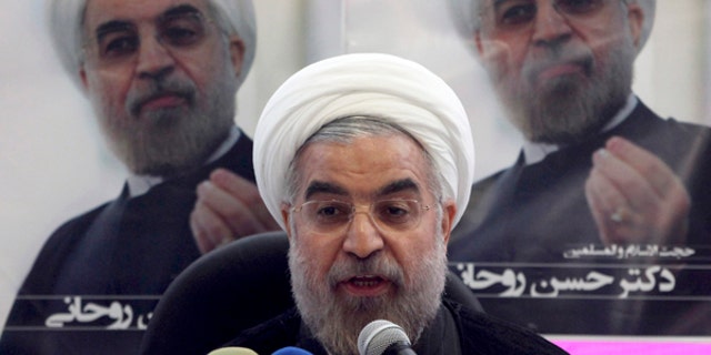 The cabinet assembled by new Iranian President Hasan Rowhani is made up of 18 mostly hard-liners. (AP Photo/Vahid Salemi)