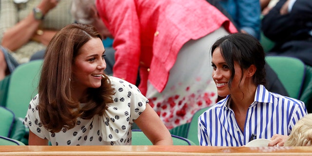 Kate, Duchess of Cambridge and Meghan, Duchess of Sussex, right, sit in the Royal Box on Centre Court ahead of the women's singles final match between Serena Williams of the US and Angelique Kerber of Germany at the Wimbledon Tennis Championships, in London, Saturday July 14, 2018. (Andrew Couldridge, Pool via AP)