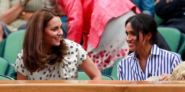 Kate, Duchess of Cambridge and Meghan, Duchess of Sussex, right, sit in the Royal Box on Centre Court ahead of the women's singles final match between Serena Williams of the US and Angelique Kerber of Germany at the Wimbledon Tennis Championships, in London, Saturday July 14, 2018. (Andrew Couldridge, Pool via AP)