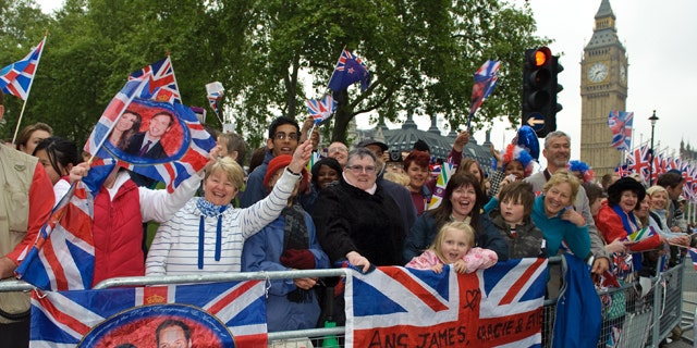 April 29: Enthusiastic crowds await the Royal Wedding in Parliament Square, London.