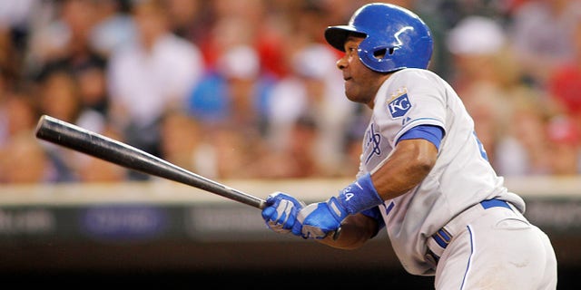 July 30, 2013: Kansas City Royals' Miguel Tejada watches his RBI single off Minnesota Twins pitcher Mike Pelfrey in the third inning of a baseball game in Minneapolis.
