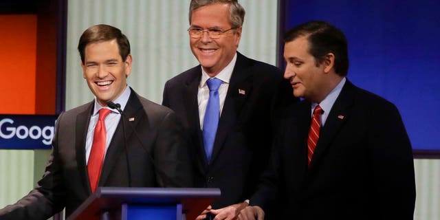 Republican presidential candidates (L-R) New Jersey Gov. Chris Christie, Sen. Marco Rubio, R-Fla., former Florida Gov. Jeb Bush and Sen. Ted Cruz, R-Texas, talk after the Republican presidential primary debate, Thursday, Jan. 28, 2016, in Des Moines, Iowa. (AP Photo/Charlie Neibergall)