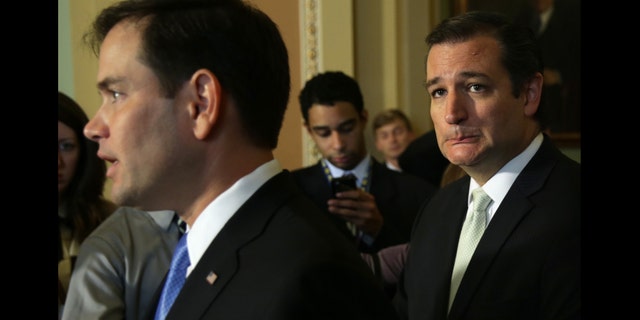 WASHINGTON, DC - SEPTEMBER 27: U.S. Senator Ted Cruz (R-TX) (R) and Senator Marco Rubio (R-FL) (L) speak to members of the media after a vote on the Senate floor September 27, 2013 on Capitol Hill in Washington, DC. The Senate has passed a continuing resolution 54-44 to fund the government through November 15 with the exclusion of defunding the Obama care in which the provision was passed in the House. (Photo by Alex Wong/Getty Images)