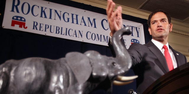 U.S. Sen. Marco Rubio, R-Fla., speaks to a group of GOP activist at the Rockingham County Republican Committee's Freedom Founders Dinner, Friday, May 9, 2014 in New Castle, N.H. (AP Photo/Jim Cole)