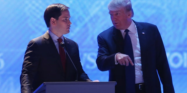 MANCHESTER, NH - FEBRUARY 06:  Republican presidential candidates Sen. Marco Rubio (R-FL) (L) and Donald Trump talk during a commercial break in the Republican presidential debate at St. Anselm College February 6, 2016 in Manchester, New Hampshire. Sponsored by ABC News and the Independent Journal Review, this is the final televised debate before voters go to the polls for the New Hampshire primary on February 9.  (Photo by Joe Raedle/Getty Images)