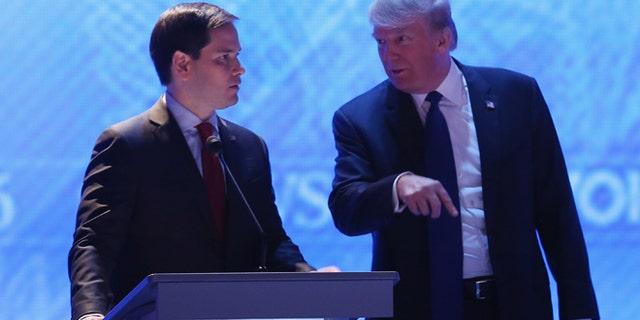 MANCHESTER, NH - FEBRUARY 06: Republican presidential candidates Sen. Marco Rubio (R-FL) (L) and Donald Trump talk during a commercial break in the Republican presidential debate at St. Anselm College February 6, 2016 in Manchester, New Hampshire. Sponsored by ABC News and the Independent Journal Review, this is the final televised debate before voters go to the polls for the New Hampshire primary on February 9. (Photo by Joe Raedle/Getty Images)