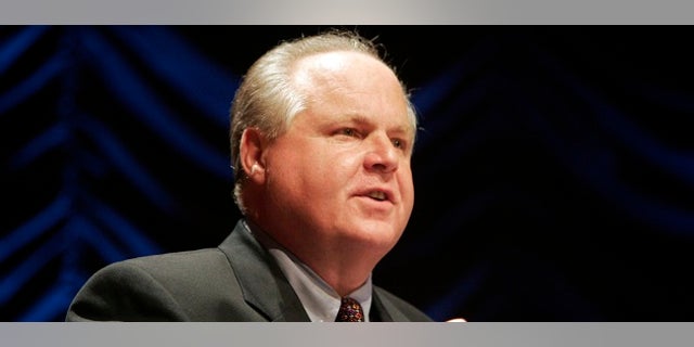 Radio show host Rush Limbaugh speaks at a forum hosted by the Heritage Foundation, on the similarities between the war on terrorism and the television show "24," in Washington June 23, 2006. REUTERS/Micah Walter (UNITED STATES) - RTR1ESGV