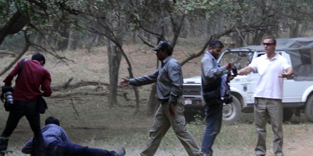 Oct. 22: An AP photographer captured images of an altercation between Brand's entourage and photographers in India.