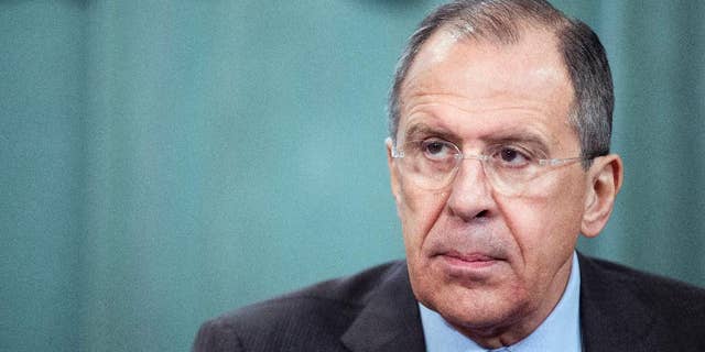 Russian Foreign Minister Sergey Lavrov attends a news conference after meeting with Foreign Ministers of the Commonwealth of Independent States (CIS) in Moscow, Russia, Friday, April 4, 2014. Russia had no connection to the snipers in Ukraine and could not have any relation, said Russian Foreign Minister Sergey Lavrov on Friday in Moscow after the meeting with Foreign Ministers of the CIS. (AP Photo/Ivan Sekretarev)