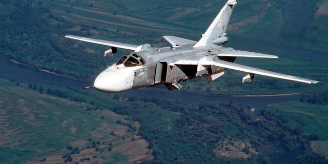 FILE In this file photo taken in this 2002 shows a Russian Su-24 medium-range bomber, known by NATO as "Fencer," flies somewhere at undisclosed location in Russia. A senior Russian government official said Friday March 27, 2015 that Moscow hasn’t held negotiations on leasing a dozen of supersonic bombers to Argentina, but would be willing to consider it.(AP Photo/File)