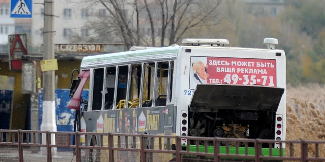 Oct. 21, 2013 - A damaged bus is examined by experts in Volgograd. The blast was caused by an unspecified explosive device, the National Anti-Terrorism Committee said in a statement. At least five died and 32 were injured.