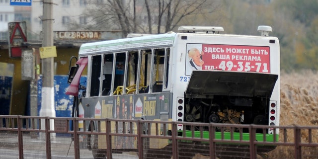 Oct. 21, 2013 - A damaged bus is examined by experts in Volgograd. The blast was caused by an unspecified explosive device, the National Anti-Terrorism Committee said in a statement. At least five died and 32 were injured.