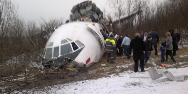 In this photo taken on a cell phone by an eyewitness, showing a Tupolev Tu-154 passenger jet belonging to Dagestan Airlines is seen after an emergency landing on Saturday, Dec. 4, 2010, at Moscow Domodedovo aiport. The passenger jet with 155 people aboard skidded off the runway during an emergency landing at the Moscow airport on Saturday, killing two people and injuring some dozens of others, Russian officials said, after all of its three engines failed.