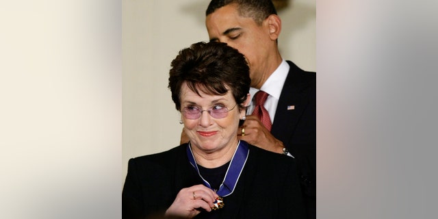 In this file photo, President Barack Obama presents the 2009 Presidential Medal of Freedom to Billie Jean King, known for winning the famous "Battle of the Sexes" tennis match, and championing gender equality issues, during ceremonies at the White House in Washington.
