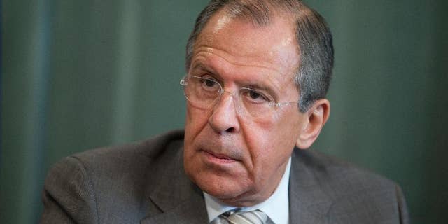 Russian Foreign Minister Sergey Lavrov attends a press conference after meeting with his South Sudanese counterpart Barnaba Benjamin at the Foreign Ministry mansion in Moscow, Russia, Monday, May 26, 2014. Sergey Lavrov said Russia has a positive view on Ukraine's presidential vote and is ready to deal with billionaire candy tycoon Petro Poroshenko, who holds a commanding lead, according to early returns. (AP Photo/Pavel Golovkin)