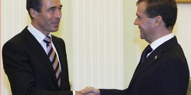 Nov. 3, 2010: Russian President Dmitry Medvedev, right, shakes hands with NATO Chief Anders Fogh Rasmussen during their meeting in the Kremlin in Moscow, Russia.