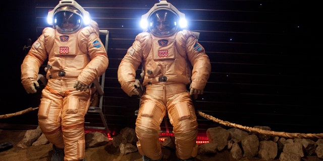 May 24, 2010: Researchers test spacesuits on a simulated Mars surface during a training session at Moscow's Institute for Medical and Biological Problems.