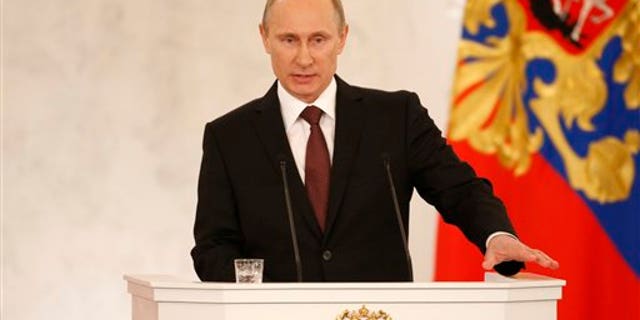 Russia's President Vladimir Putin addresses the Federation Council in Moscow's Kremlin on Tuesday, March 18, 2014.