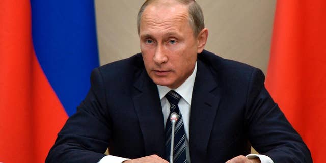 Sept. 30, 2015: Russian President Vladimir Putin holds a meeting with senior government officials at the Novo-Ogaryovo residence outside Moscow, Russia.