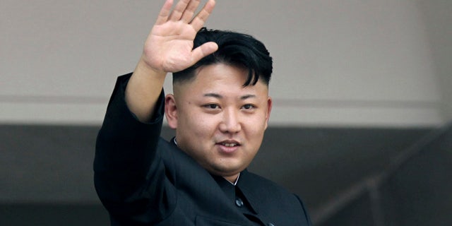 FILE - In this July 27, 2013 file photo, North Korean leader Kim Jong Un waves to spectators and participants of a mass military parade celebrating the 60th anniversary of the Korean War armistice in Pyongyang, North Korea. (AP Photo/Wong Maye-E, File)