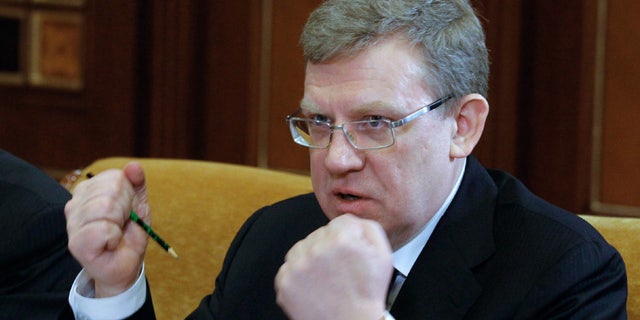 FILE 2011: Russian Finance Minister Alexei Kudrin gestures at a meeting on military salaries chaired by President Dmitry Medvedev in the Gorki residence outside Moscow, Russian.