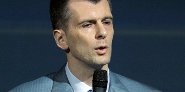June 25: Russian tycoon Mikhail Prokhorov speaks at a meeting of the Right Cause party in Moscow. Russian tycoon and New Jersey Nets basketball team owner Mikhail Prokhorov was confirmed Saturday as the new head of a Kremlin-friendly political party. The 46-year-old billionaire was all but unanimously elected head of the Right Cause party by its members on Saturday.