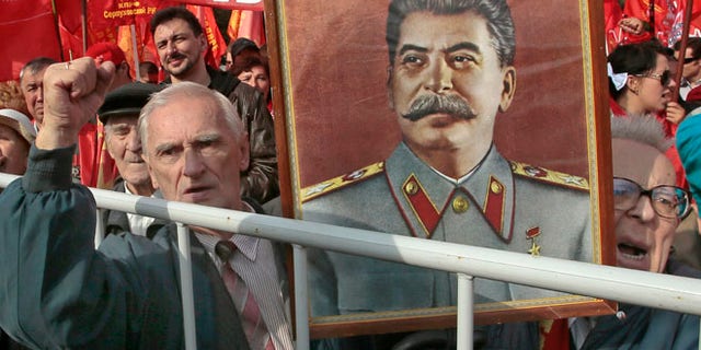 Sept. 22, 2012: Russian Communist Party supporters hold a portrait of former Soviet dictator Josef Stalin at a gathering in Moscow to protest increasing prices for communal services.