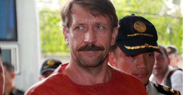 August 20: Suspected Russian arms dealer Viktor Bout, is escorted by prison officials as he arrives at the criminal court in Bangkok, Thailand.(AP)