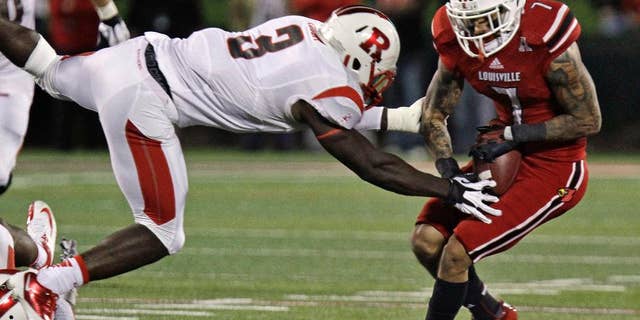 FILe - In this Oct. 10 , 2013, file photo, Louisville receiver Damian Copeland (7) catches a pass despite pressure from Rutgers' defender Steve Longa (3) during the first half of an NCAA college football game in Louisville, Ky. When Rutgers kicks off its season against Washington State Thursday night, Aug. 28, 2014, Longa will be back where he’s supposed to be _ at weakside linebacker. (AP Photo/Garry Jones, File)