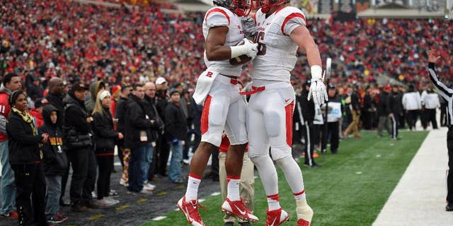 Rutgers wide receiver Leonte Carroo, left, celebrates his touchdown with Tyler Kroft, right, during the first half of an NCAA college football game against Maryland, Saturday, Nov. 29, 2014, in College Park, Md. Rutgers won 41-38. (AP Photo/Nick Wass)