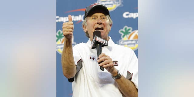 FILE - This Jan. 1, 2014, file photo shows South Carolina head coach Steve Spurrier thanking fans for their support after winning 34-24 in the Capital One Bowl NCAA college football game against Wisconsin in Orlando, Fla. Spurrier thinks South Carolina still has plenty of good players, maybe even good enough to win the head ball coach what he covets most _ a Southeastern Conference championship. (AP Photo/John Raoux, File)