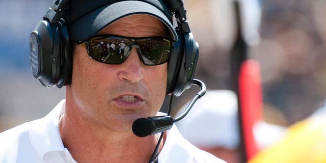 Missouri head coach Gary Pinkel talks to an official during the first quarter of an NCAA college football game against South Dakota State Saturday, Aug. 30, 2014, in Columbia, Mo. (AP Photo/L.G. Patterson)