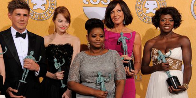 Jan. 29, 2012: Castmembers of "The Help" pose backstage with their awards for outstanding performance by a cast in a motion picture at the 18th Annual Screen Actors Guild Awards.