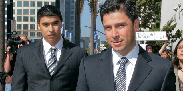 Former California Assembly Speaker Fabian Nunez, right, and his son Esteban Nunez, left, leave a hearing in Superior Court in San Diego