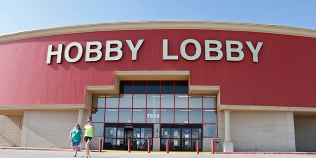 Customers leave a Hobby Lobby store in Oklahoma City, Monday, June 30, 2014. The Supreme Court ruled Monday that employers can hold religious objections that allow them to opt out of the new health law requirement that they cover contraceptives for women. The Hobby Lobby chain of arts-and-crafts stores is by far the largest employer of any company that has gone to court to fight the birth control provision. (AP Photo/Sue Ogrocki)
