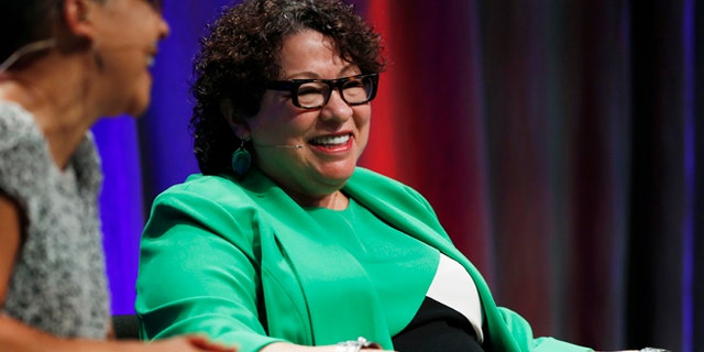 Supreme Court Justice Sonia Sotomayor jokes with Lauren Casteel during an appearance on the campus of Metropolitan State University, Thursday, Sept. 1, 2016, in Denver. (AP Photo/David Zalubowski)